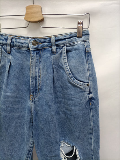 INSIDE. Pantalón slouchy rotos T.36