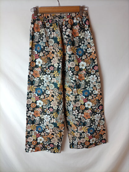 ERIC&CHIC .Pantalones negros flores T.XS