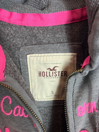 HOLLISTER. Sudadera gris letras rosas. T S