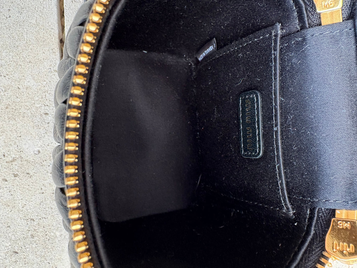 MIU MIU. Matelassé nappa leather micro bag