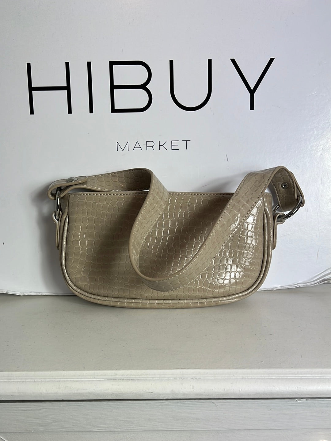 ASOS. Bolso mini beige troquelado