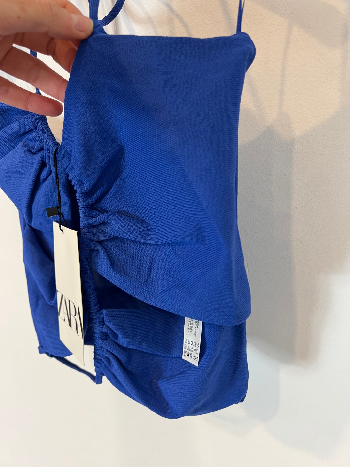ZARA. Elastic blue top with openings. TM