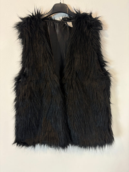 H&M. Chaleco negro pelo