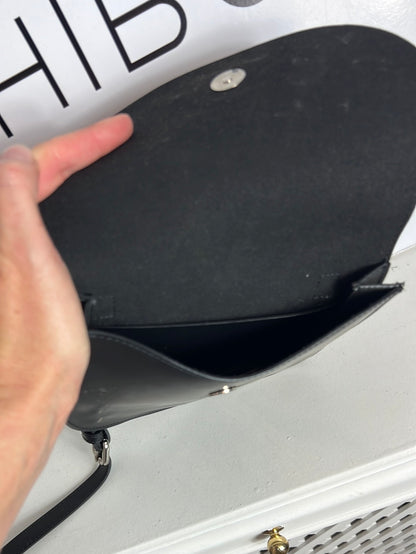 AMT. Flat black mini bag