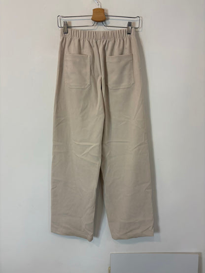 ZARA. Pantalón color crudo textura