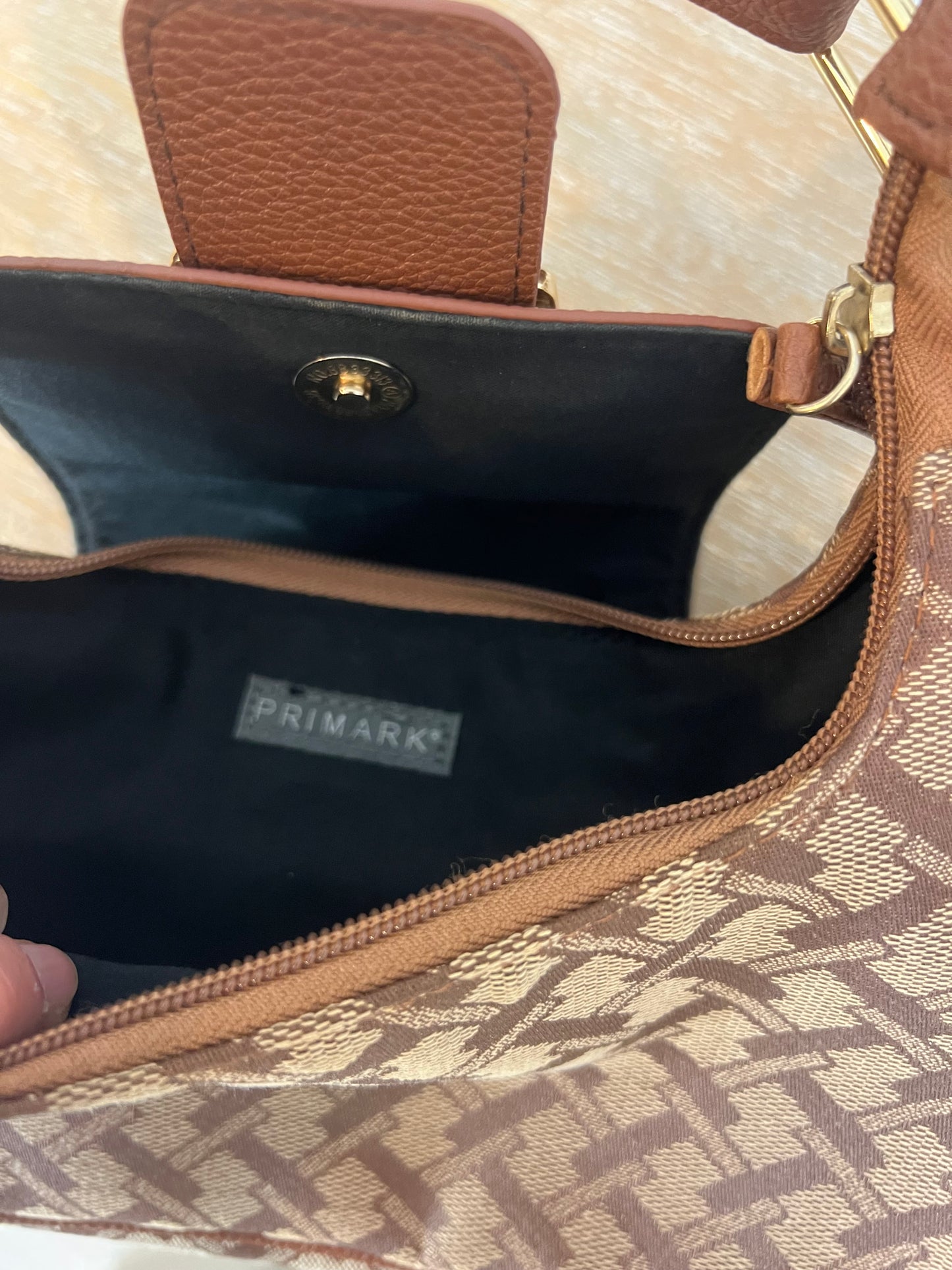 PRIMARK. Camel-printed bag
