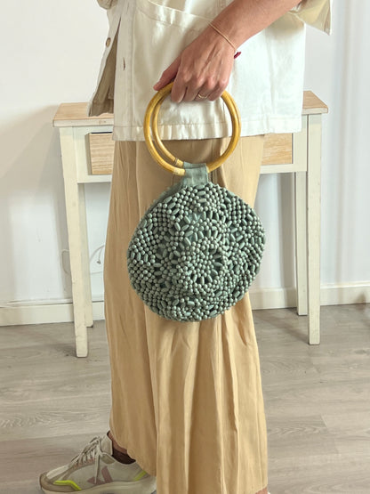 SALVADOR BACHILLER. Bolso redondo detalle asa