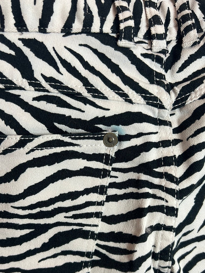 APRIL 77. Denim pitillo estampado cebra . T 36