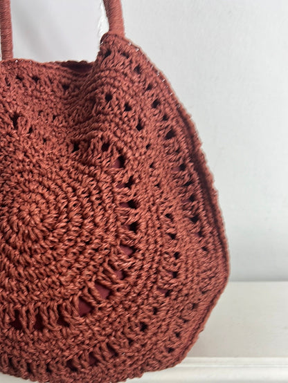 PIMKIE. Bolso rafia color teja redondo