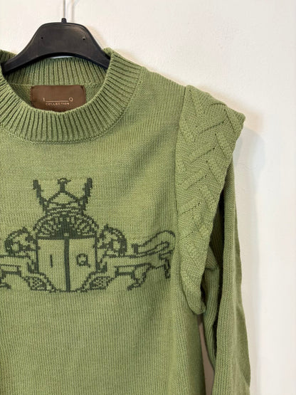 IQ. Jersey verde dibujo con lana