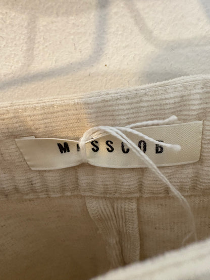 MASSCOB. Falda midi beige jaspeada