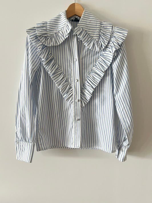 VOGANA. Blusa blanca cuello