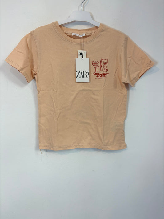ZARA. Camiseta tono pastel dibujo espalda. T 7 años
