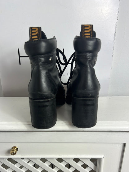 MIU MIU. Black lace-up heeled ankle boots. Size 39
