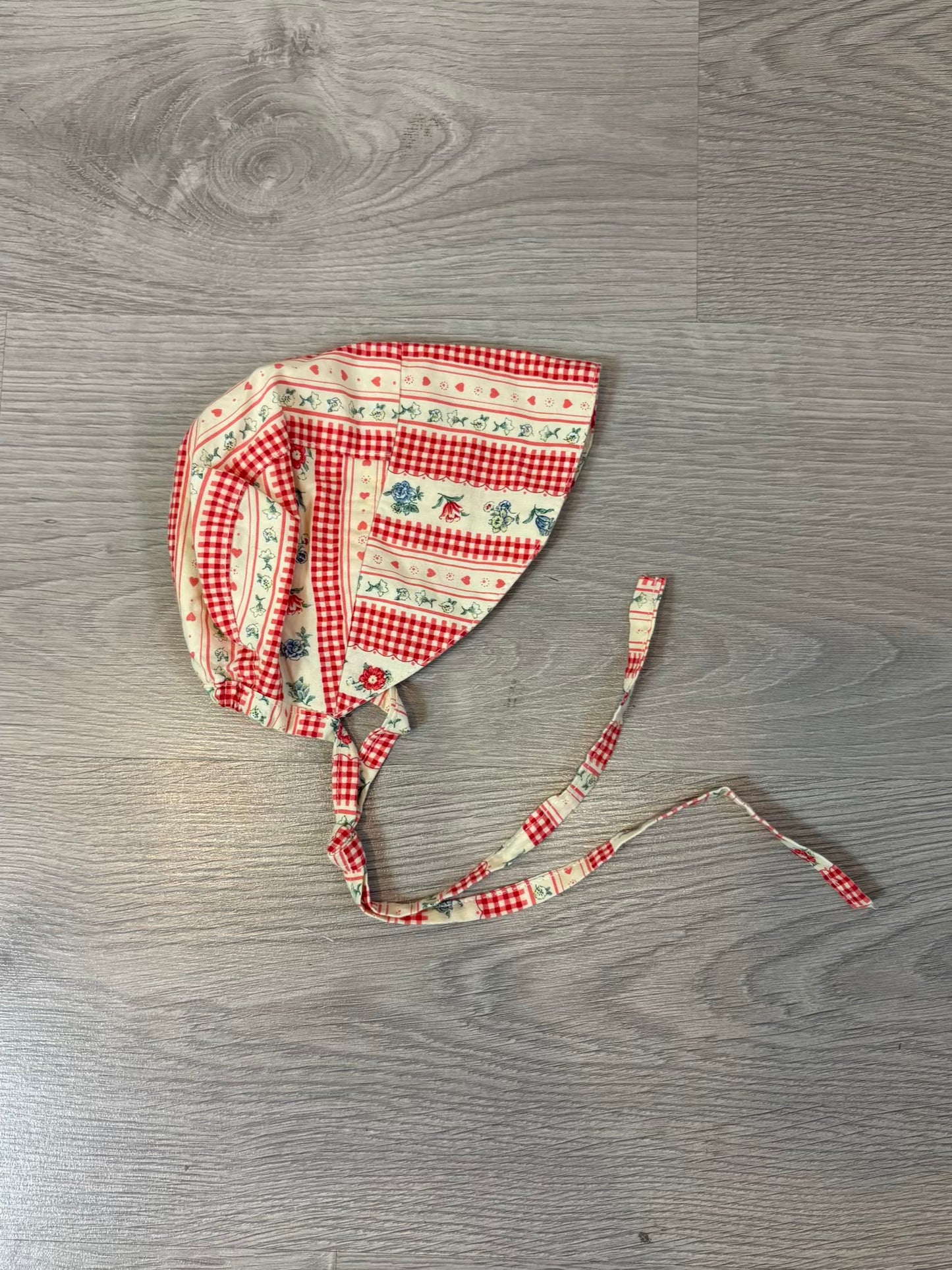 OMINI. Gorro/visera flores naranjas T. 3 meses
