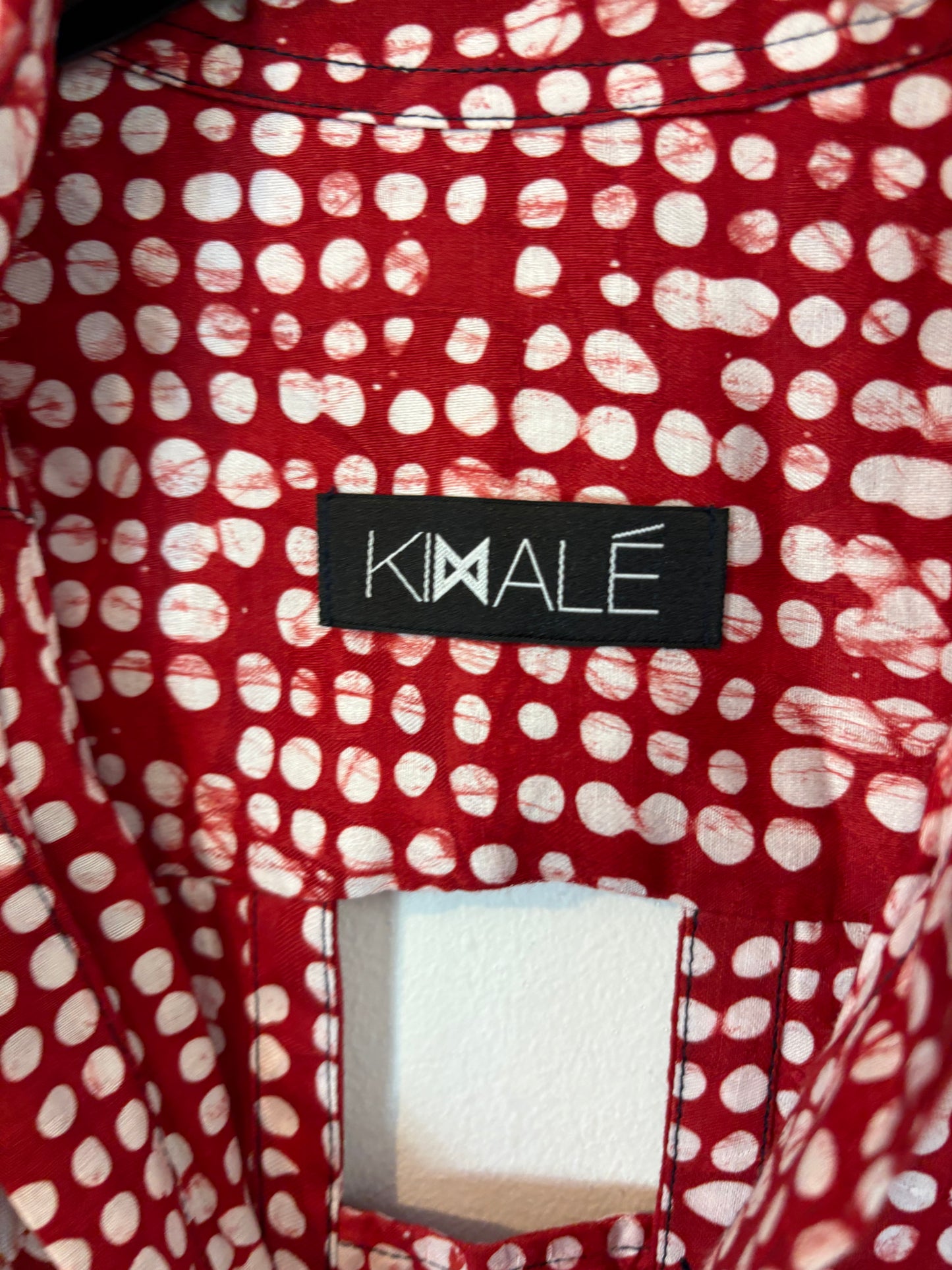 KIMALÉ. Conjunto falda y camisa roja estampada. T 36