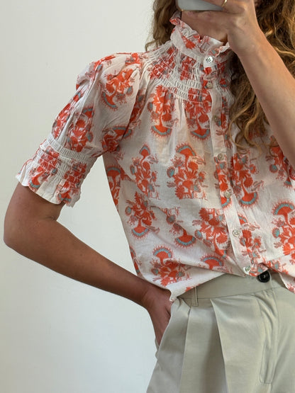OTRAS. Blusa estampada nido de abeja