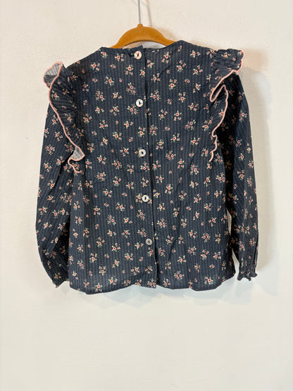 MI CANESÚ.  Camisa azul flores volantes. T 36 meses