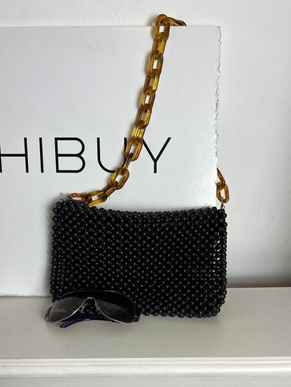 UTERQÜE. Bolso negro bolas