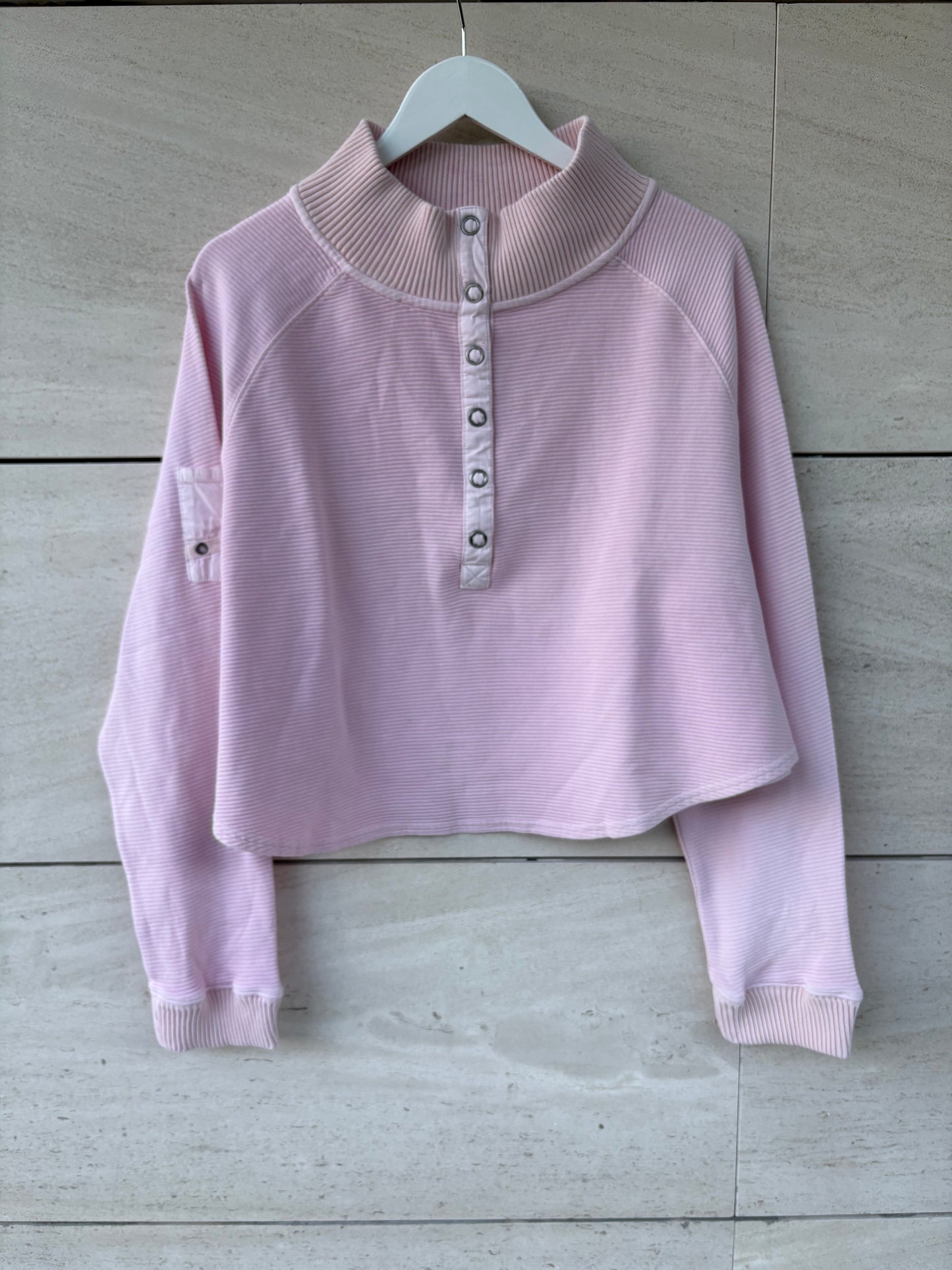 FREE PEOPLE MOVEMENT. Sudadera rosa claro textura