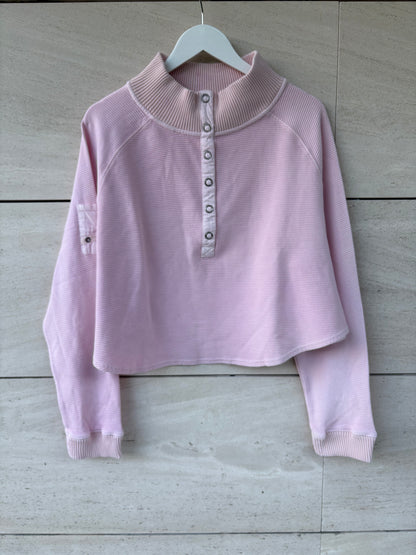 FREE PEOPLE MOVEMENT. Sudadera rosa claro textura