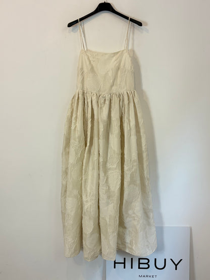 H&M. Vestido midi textura y vuelo. T XS