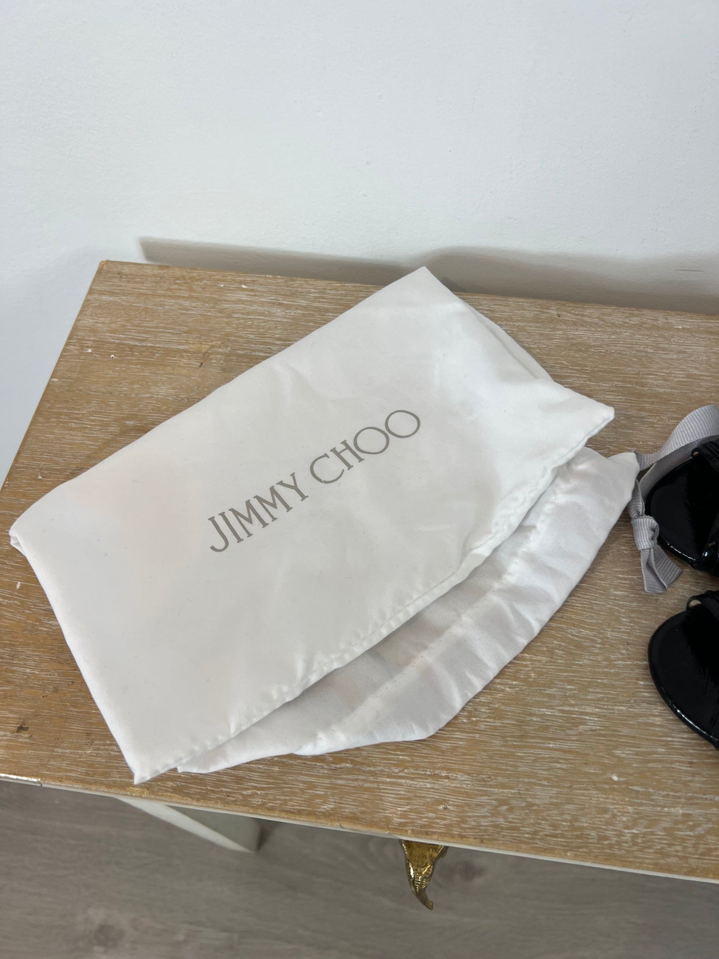 JIMMY CHOO. Black patent leather peeptoe heels. Size 37.5 (tare)