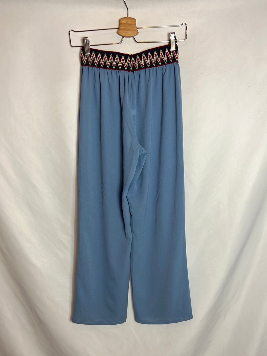TEEN BY AGATAS. Flowy blue trousers with waist detail. Size 12 years.