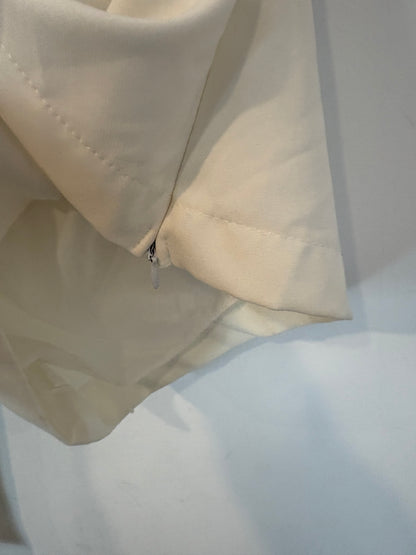 OTHERS. White asymmetrical top with puffed sleeves. TM