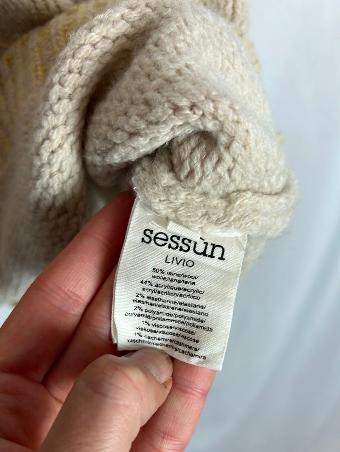 SESSUN. Sleeveless two-tone wool sweater. T.S.