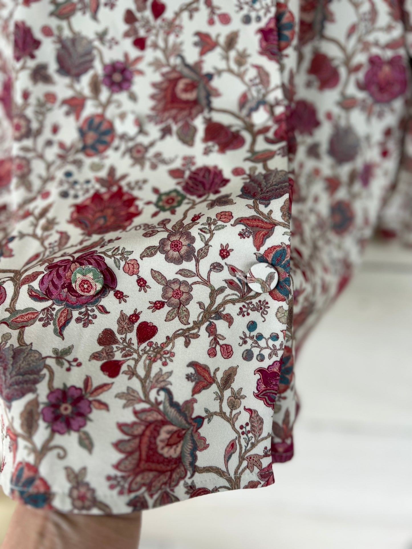 KOTIDIAN. Beige floral crossed Ts blouse