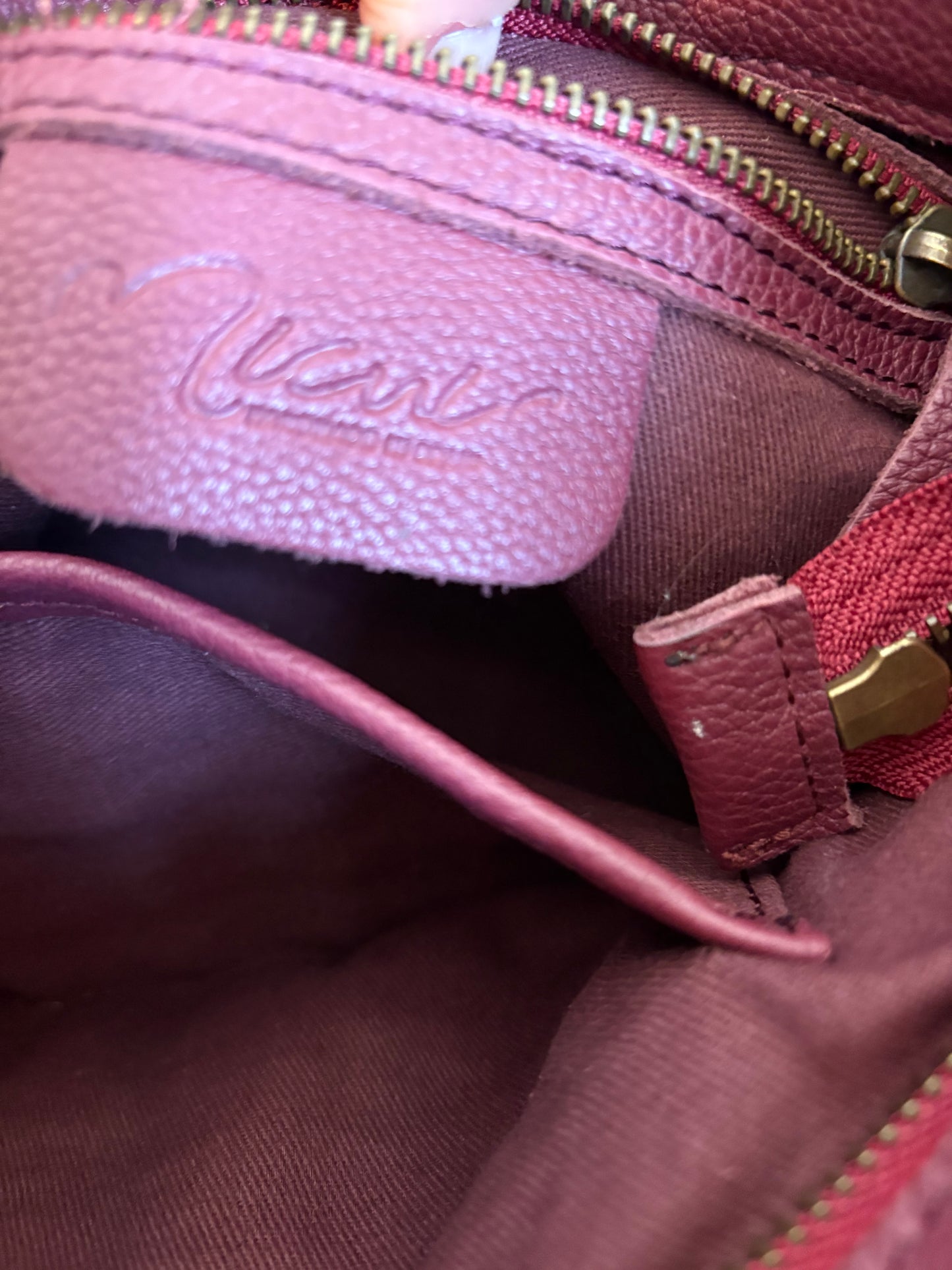 MICUIR. Bolso piel trenzada burdeos