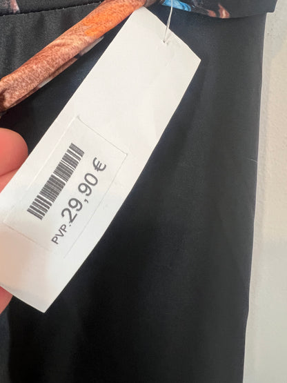 OTRAS. Falda larga fluida estampado caras. T M