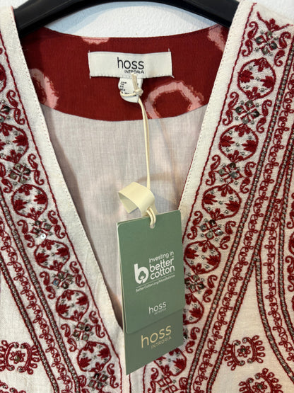 INTROPIA. Conjunto chaleco y falda detalles