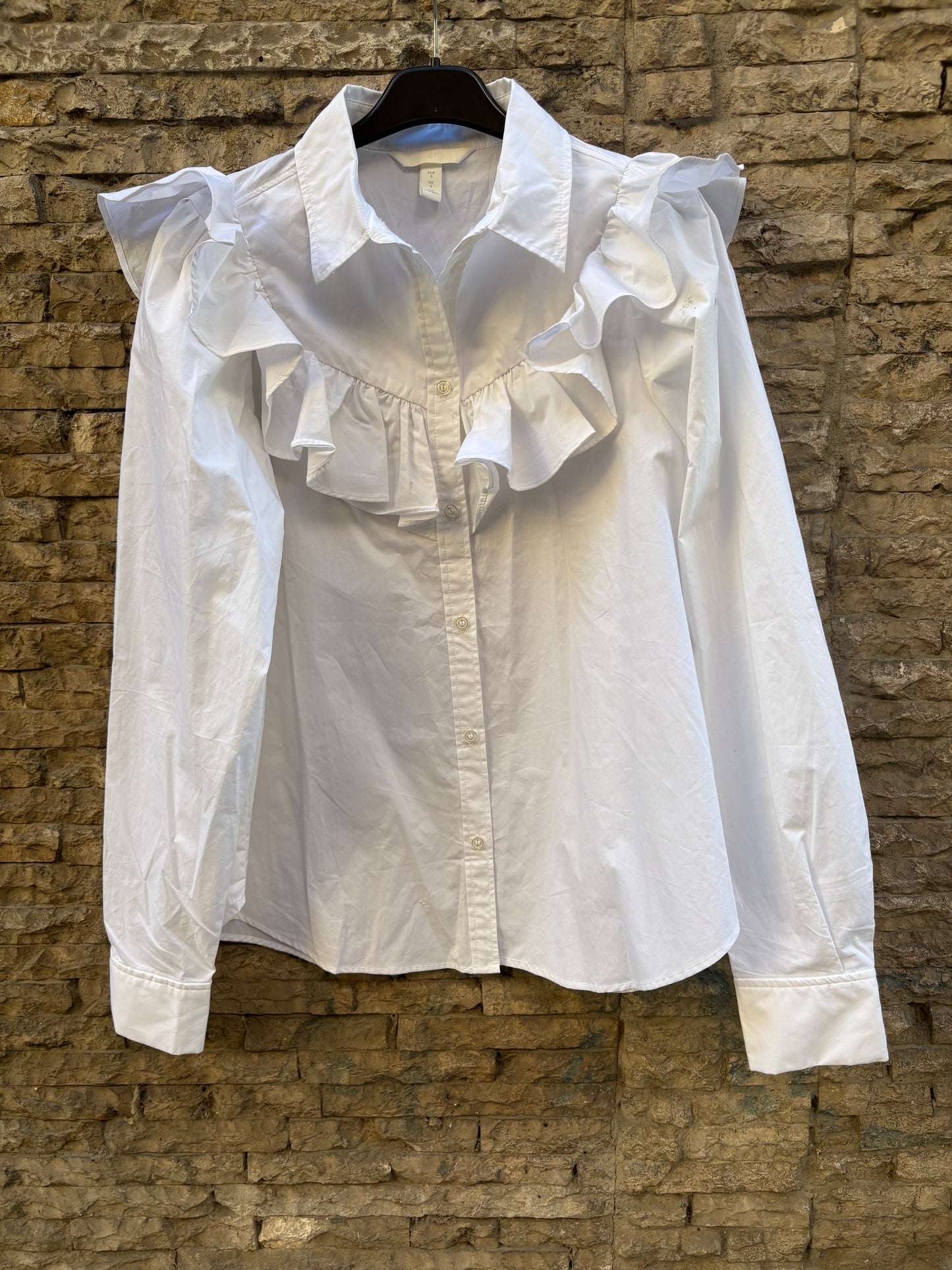 H&M. Camisa blanca volante. T S