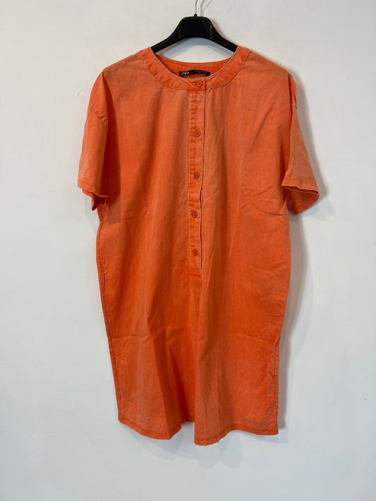 ZARA. Neon orange button-down jumpsuit with a distressed effect. TM