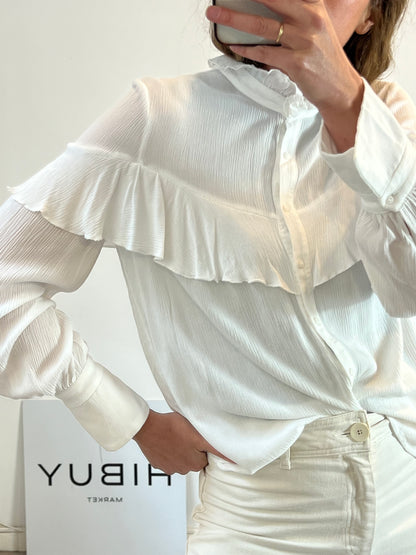 NAME THE BRAND. White ruffled blouse. TL