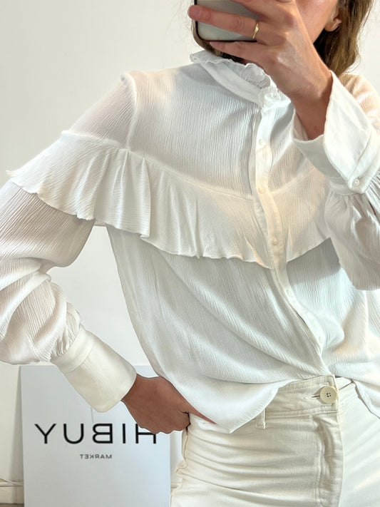 NAME THE BRAND. White ruffled blouse. TL