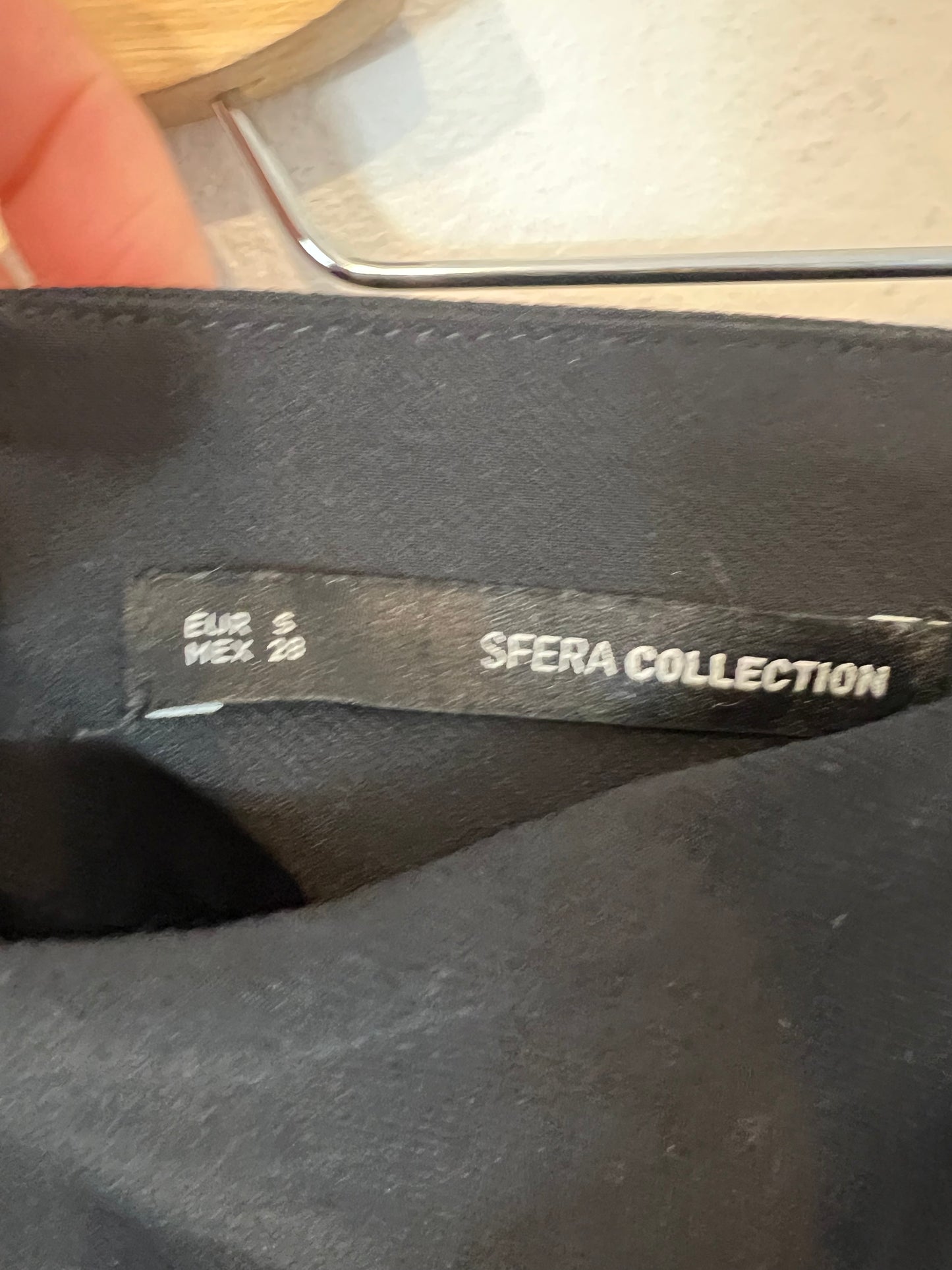 SFERA. Two-tone asymmetrical pleated skirt. T.S.