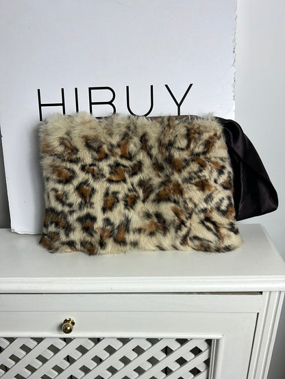 OTRAS. Bolso de mano pelo animal print