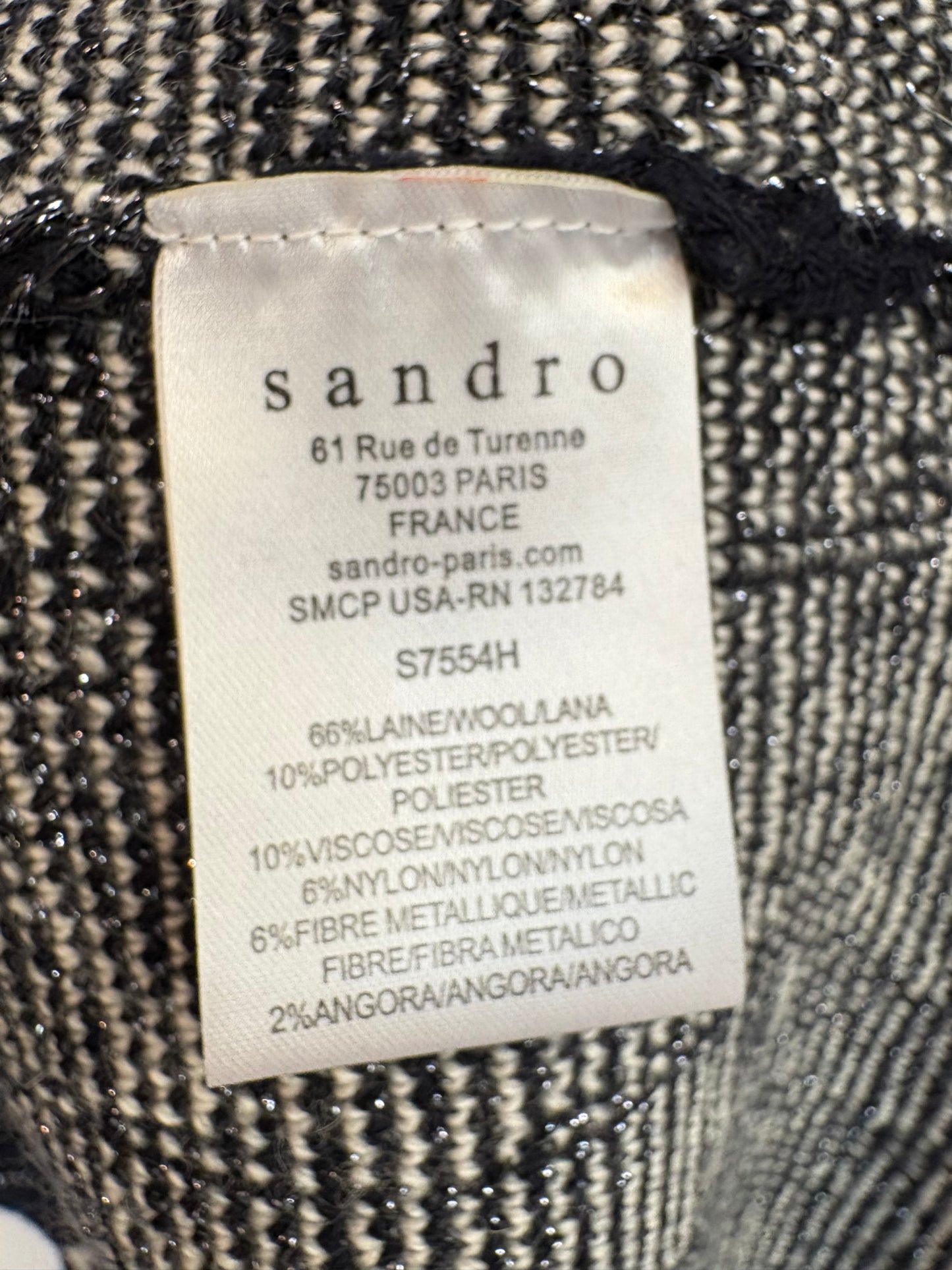 SANDRO. Top punto negro estampado lana