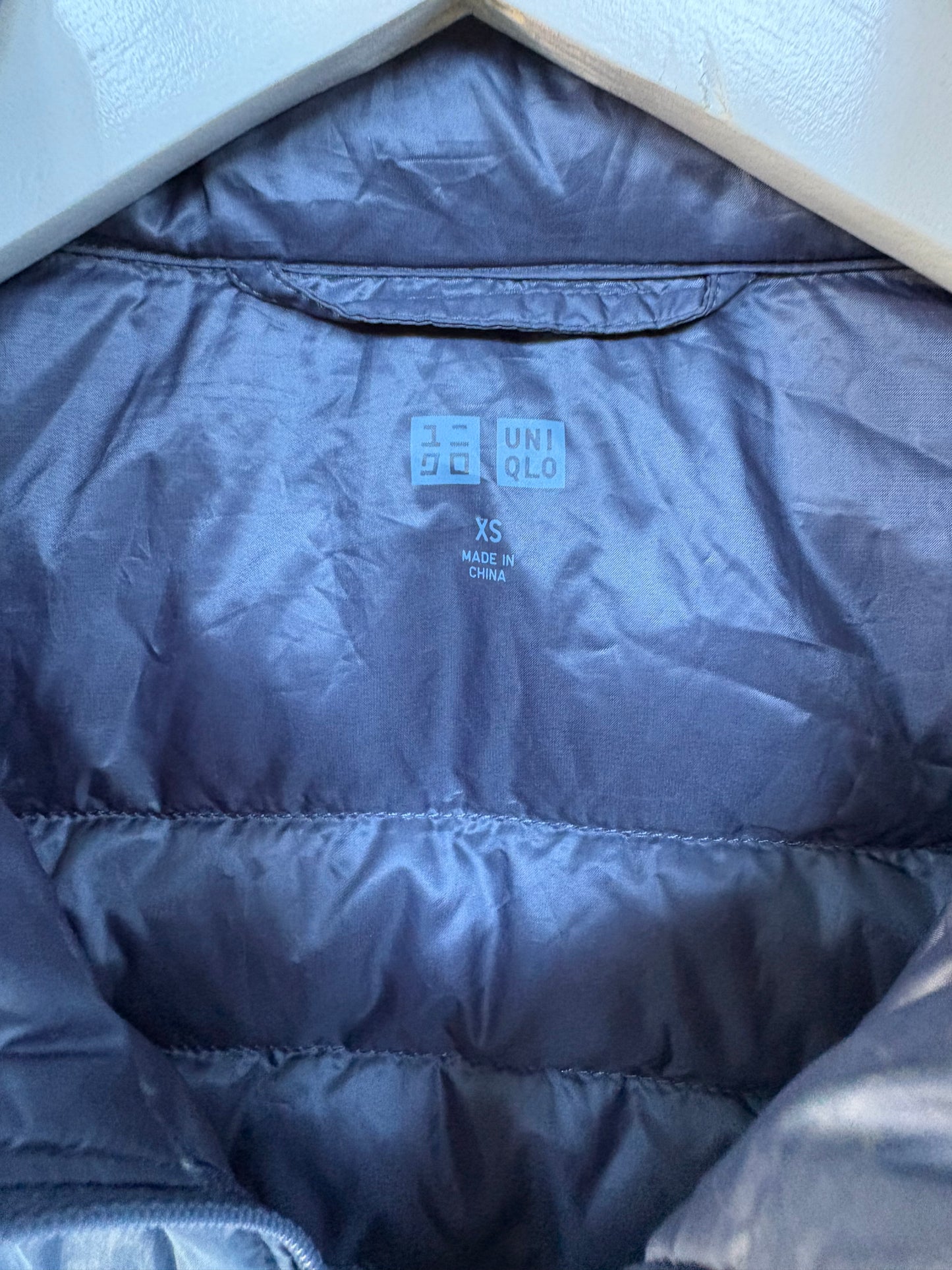 UNIQLO. Ultralight down vest in blue. XS