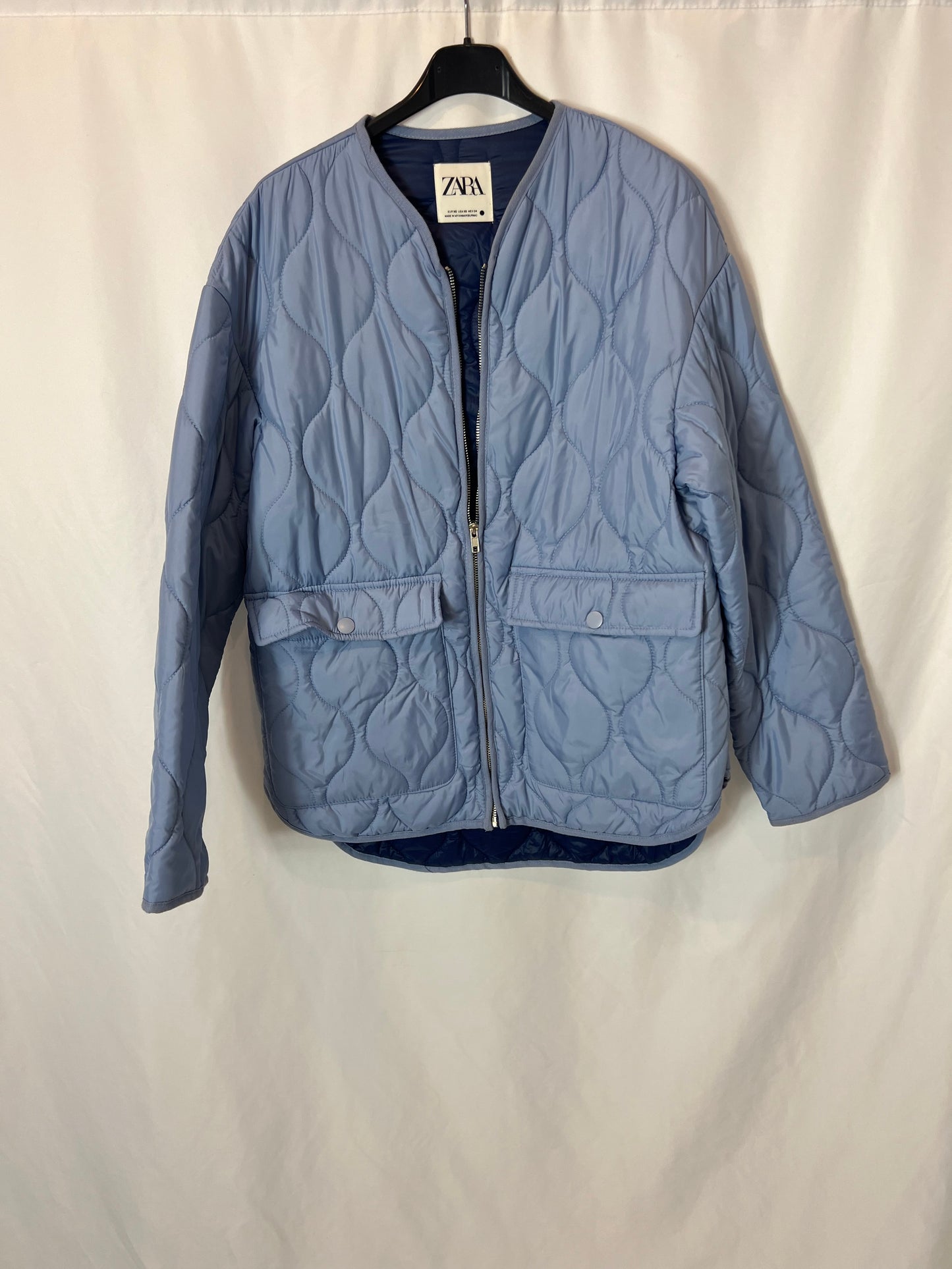 ZARA. Plumas azul bolsillos T.xs