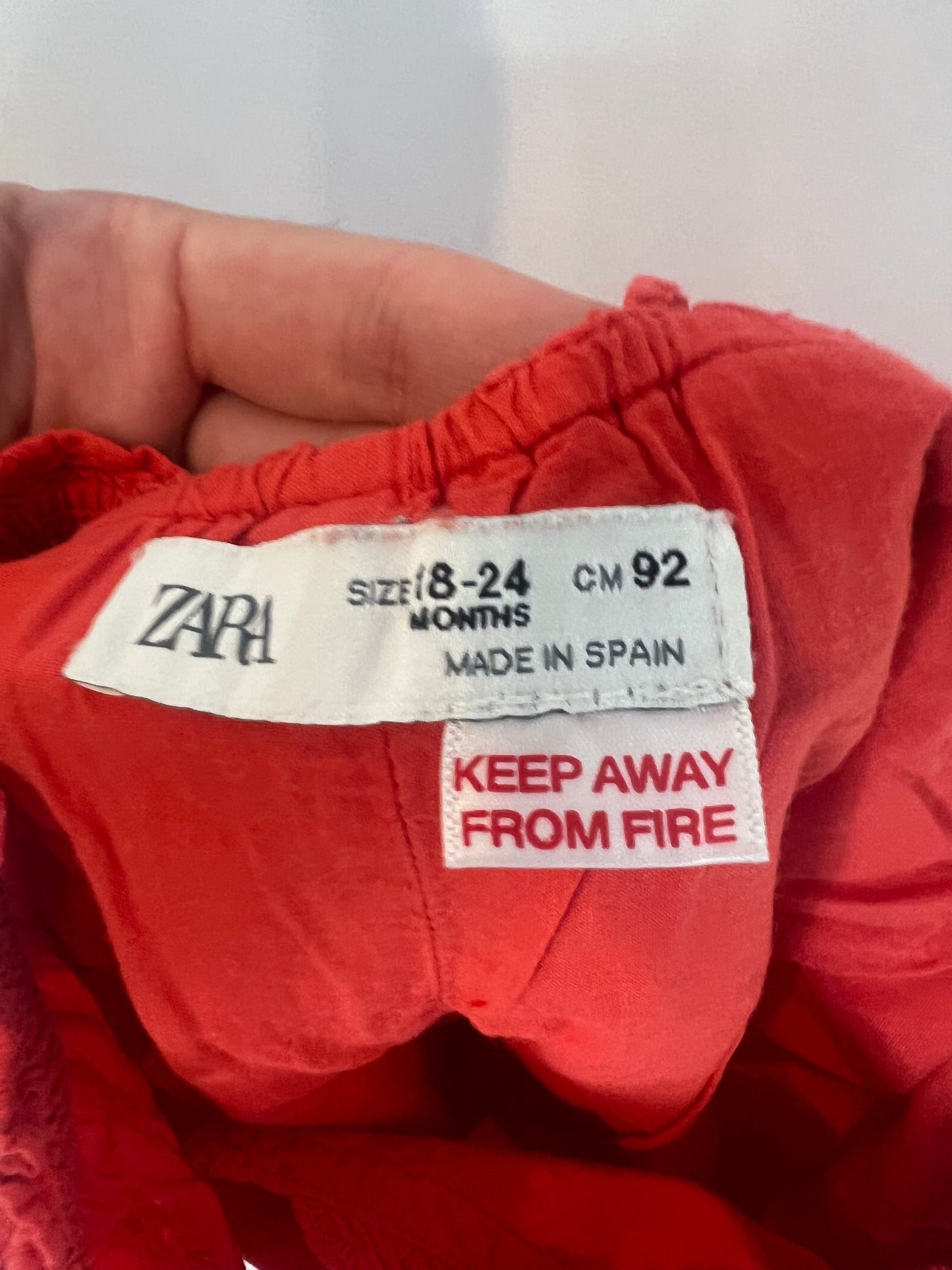 ZARA. Red die-cut jumpsuit. Size 18-24 months
