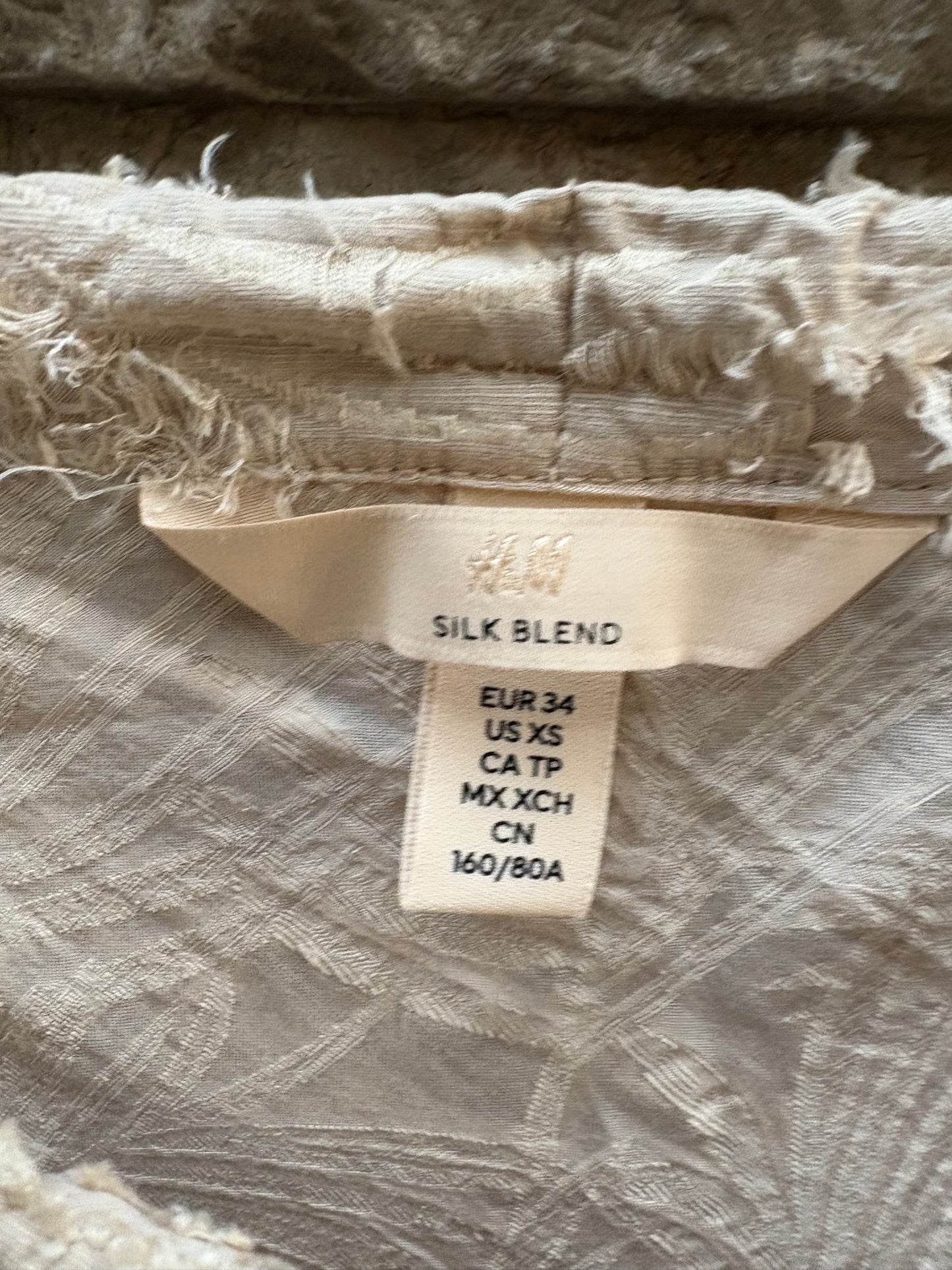 H&M. Vestido midi con seda