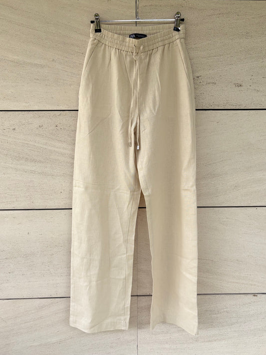 ZARA. Pantalón fluido mezcla