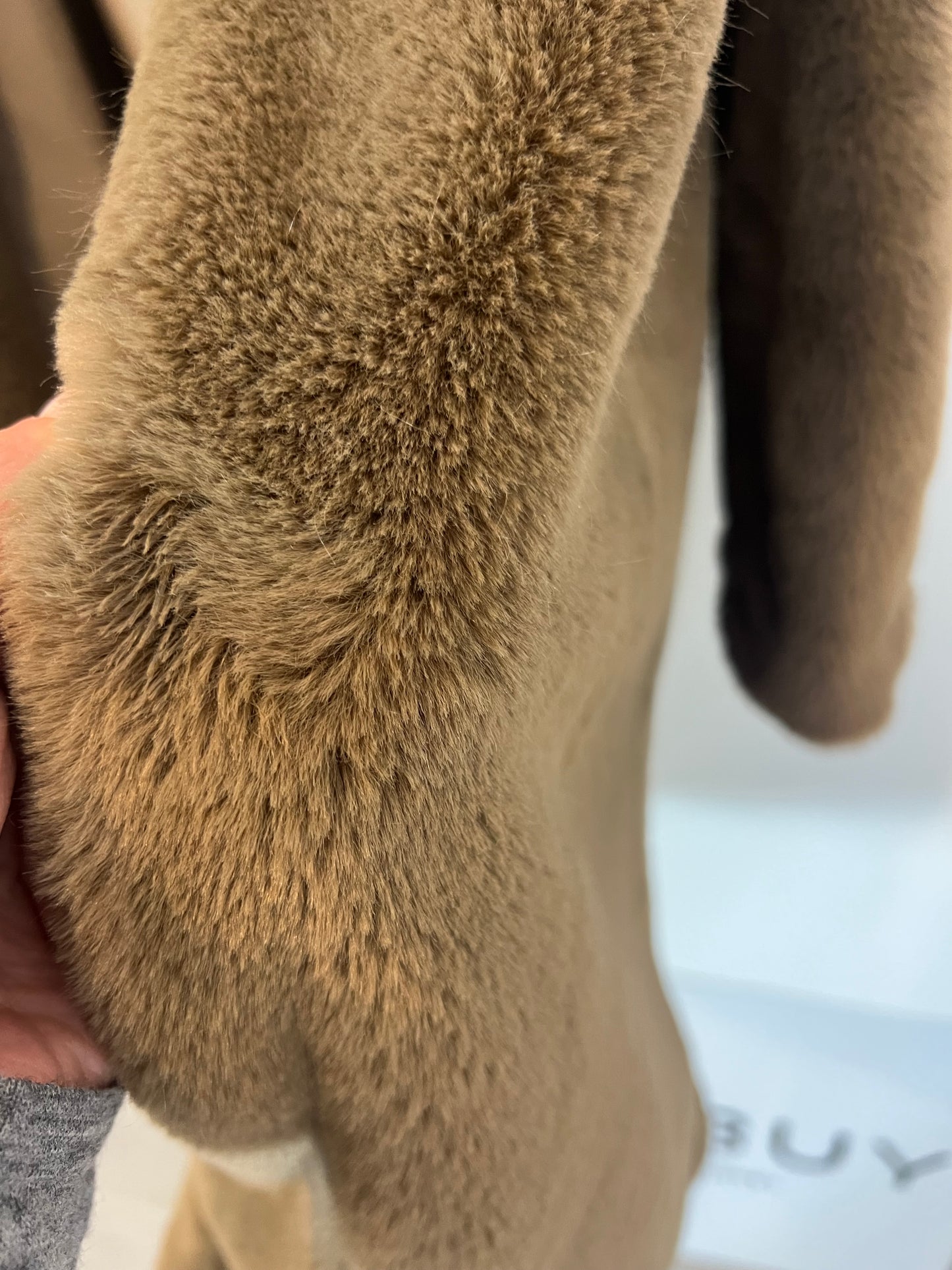 LEFTIES. Brown fur coat. T.L.