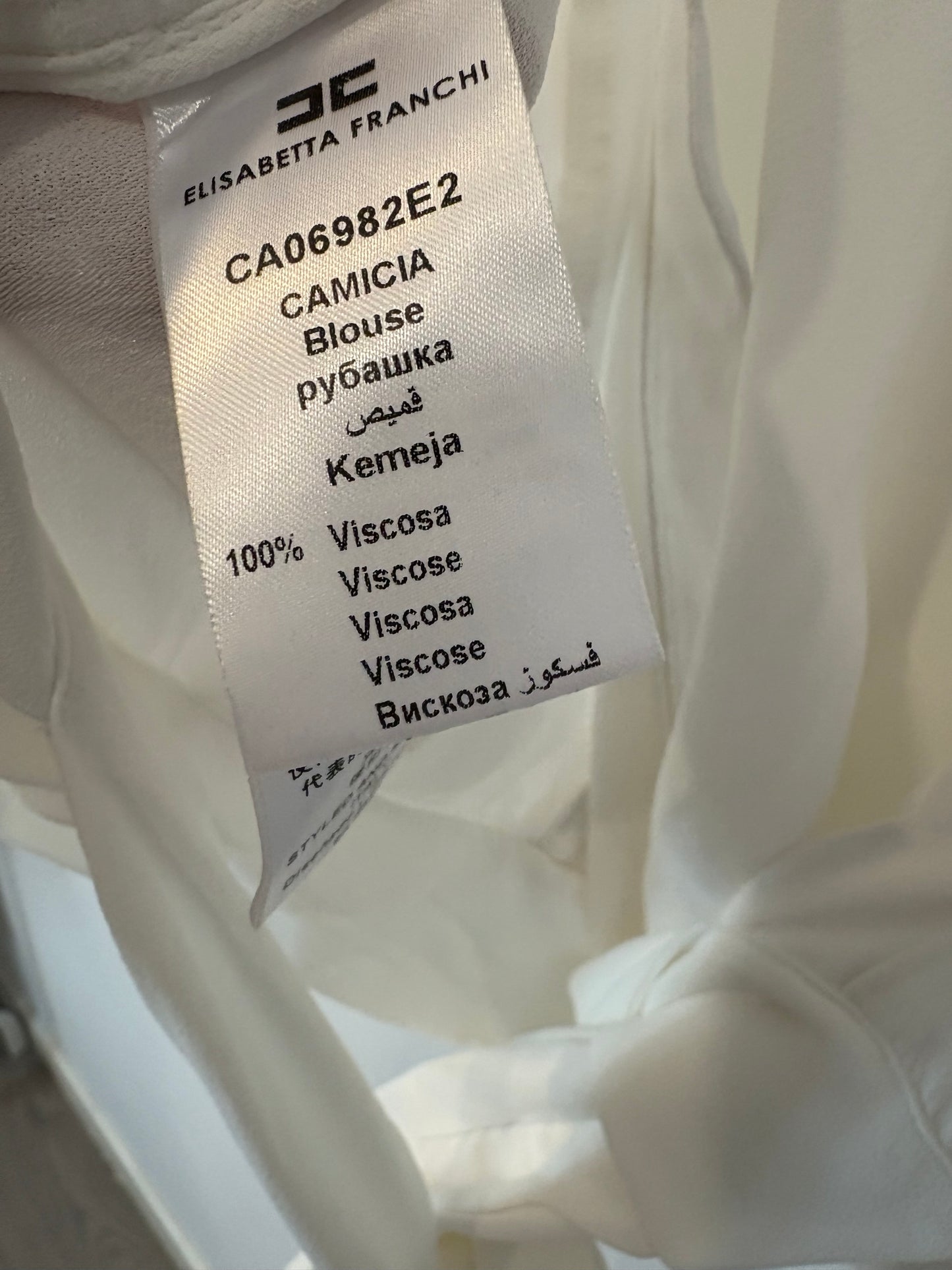 ELISABETTA FRANCHI. Top blanco aberturas/pechera