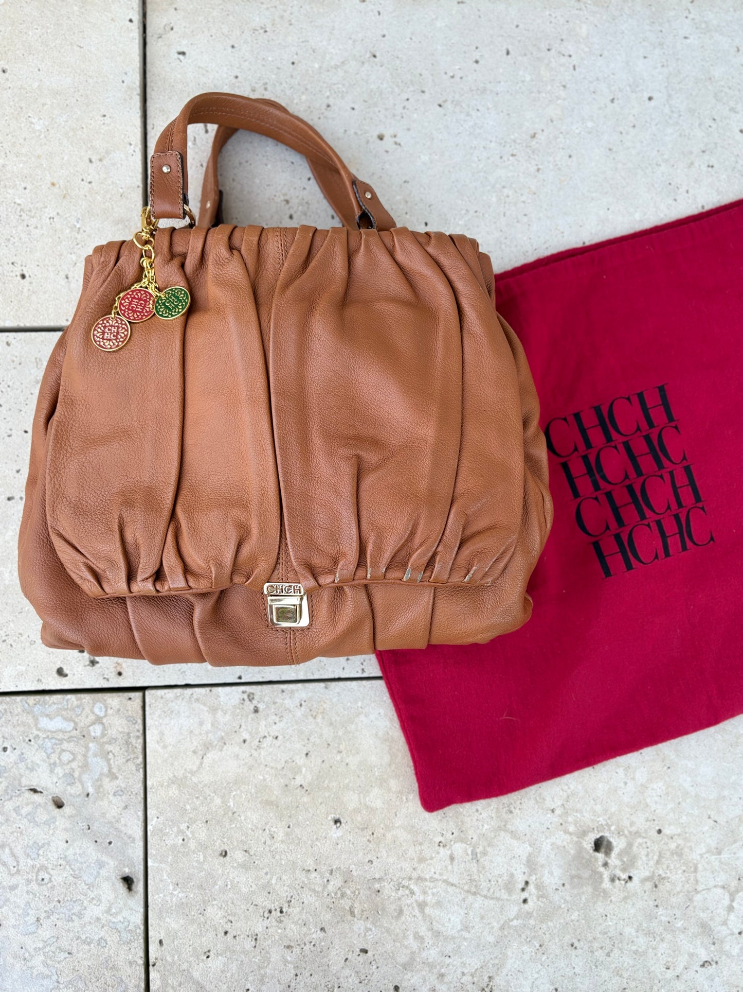 CAROLINA HERRERA. Bolso de mano en piel marrón