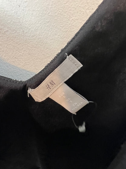 H&amp;M. Black floral Ts top